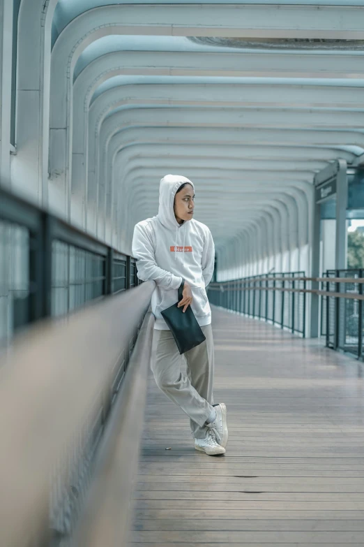 a person on a wooden pier near water