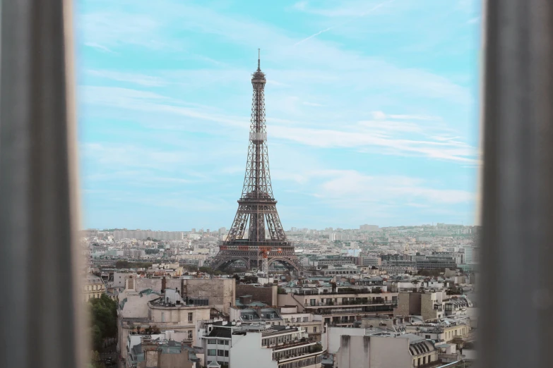 a view out a window overlooking the eiffel tower