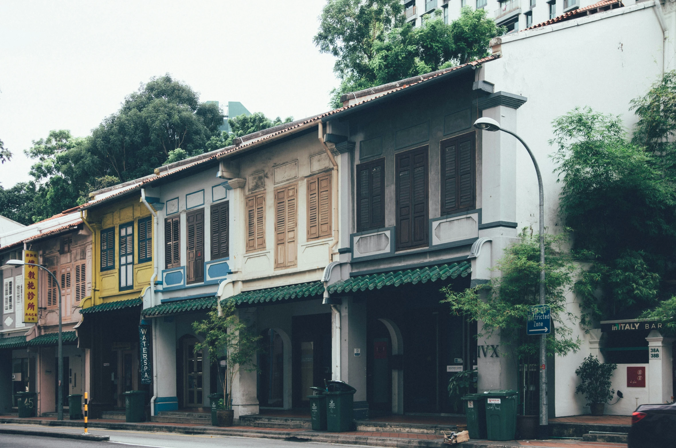 a row of buildings that are sitting on a street