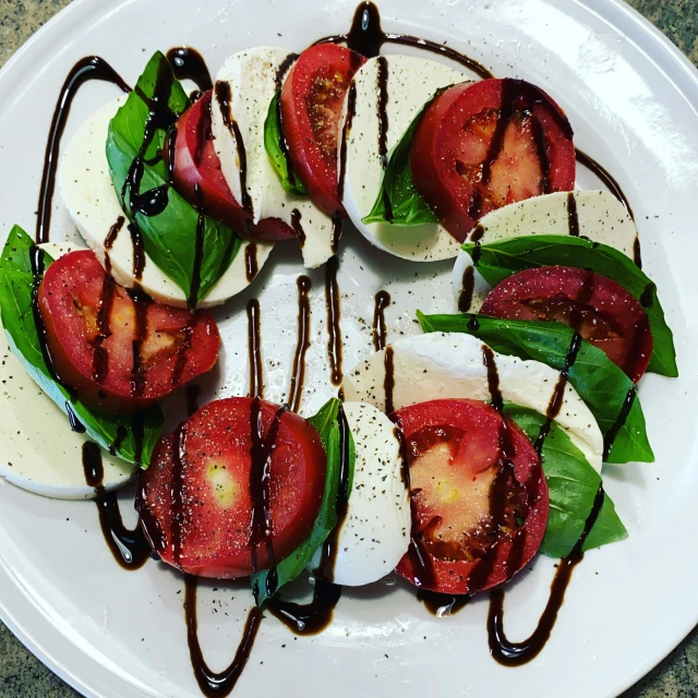 a plate is holding some strawberries and cucumber