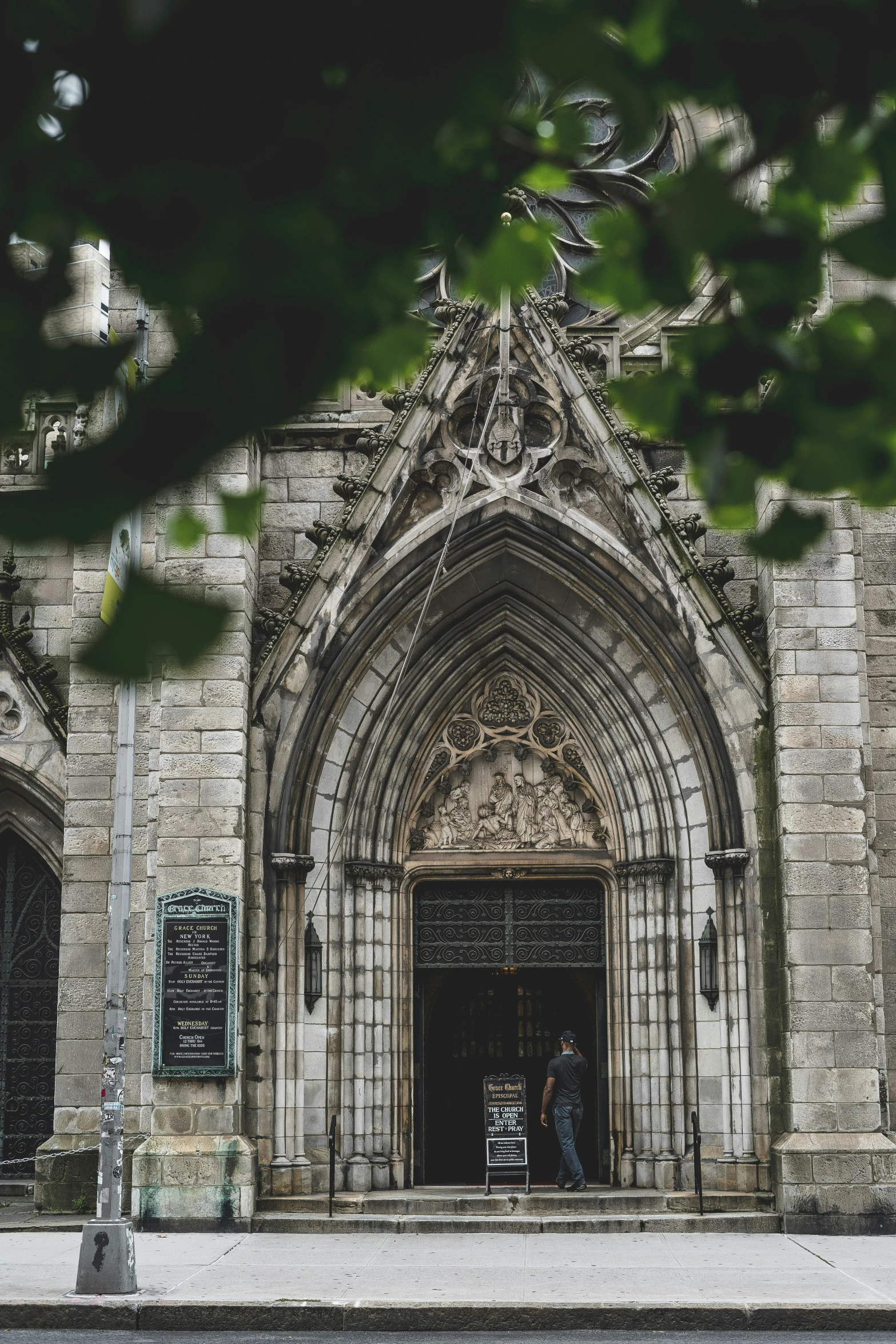 two people are standing outside a church door