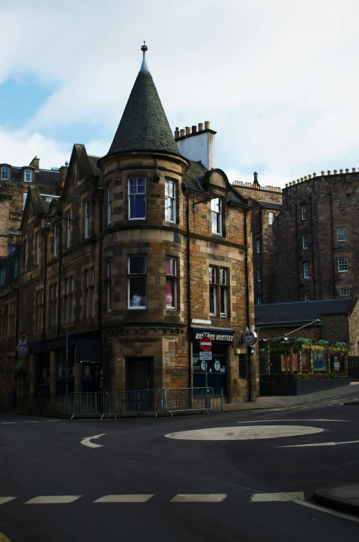 an old brick building has a tall tower