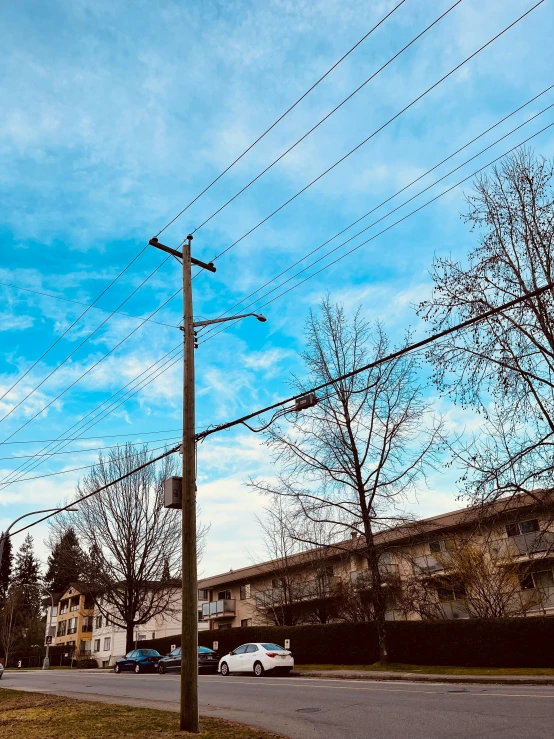 street signs and telephone poles on the corner