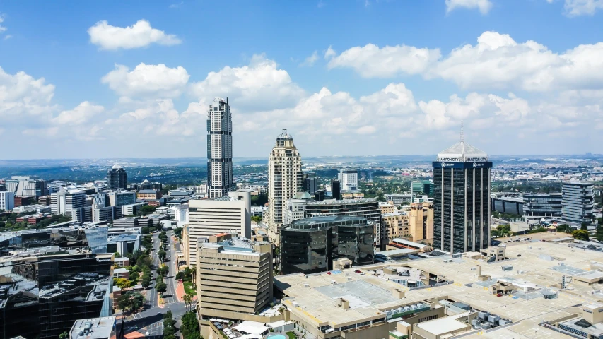 a city is pictured in the middle of a clear blue sky