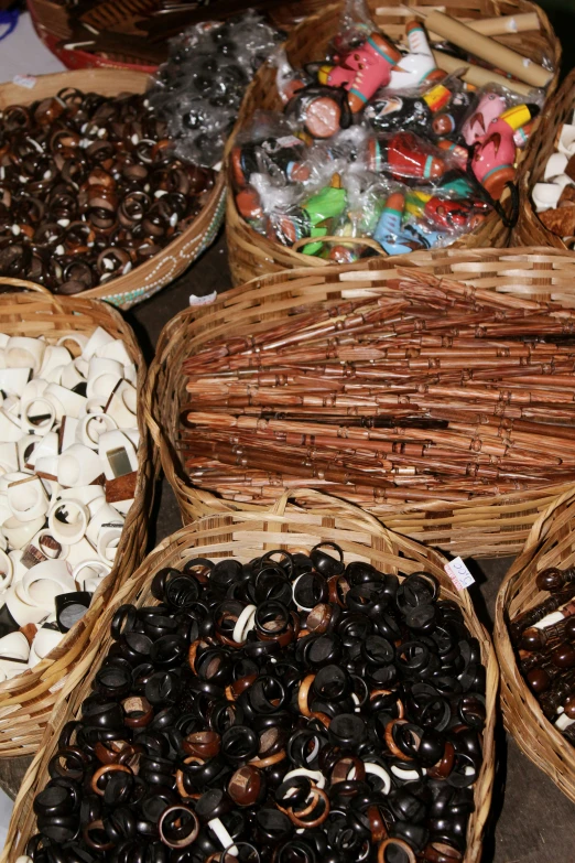 a table with many baskets full of different types of foods