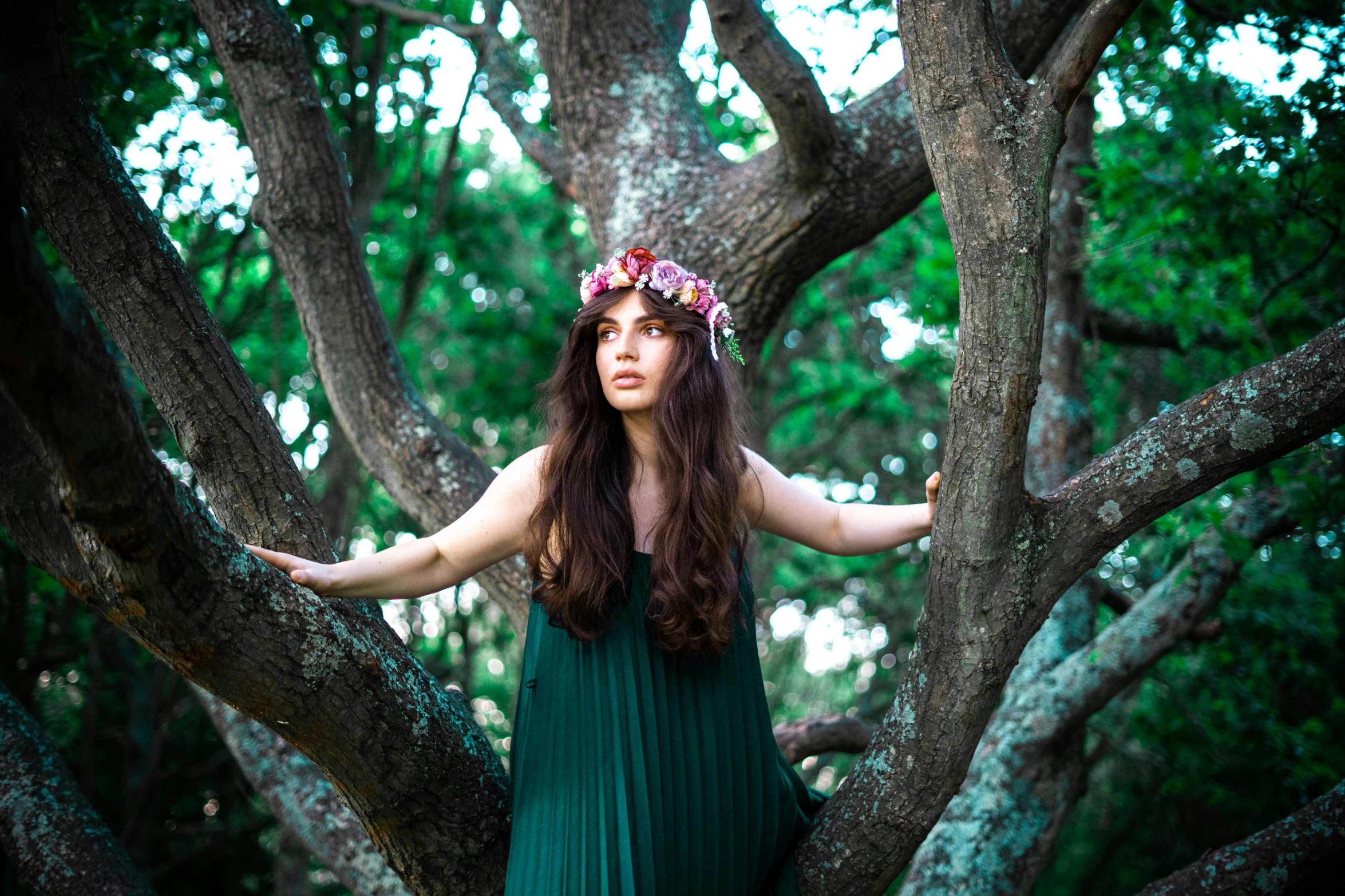 the girl is dressed up in a green dress