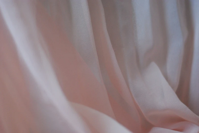 an extreme close up image of white silk fabric