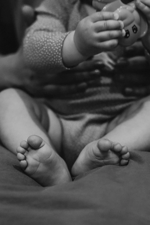 a person sitting in a lotus position and holding an object