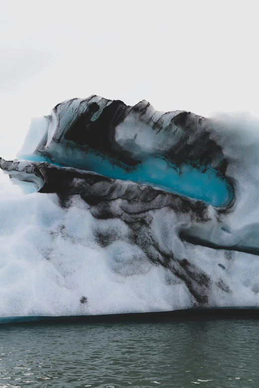 a very big ice covered mountain with a lake