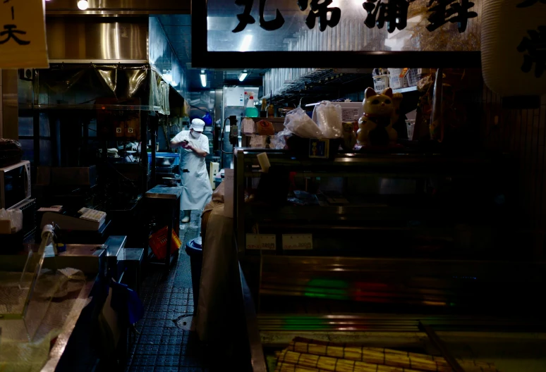 a kitchen that has a man in it