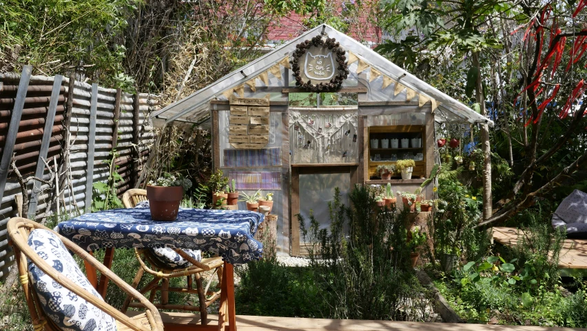 an outdoor table with a clock on top