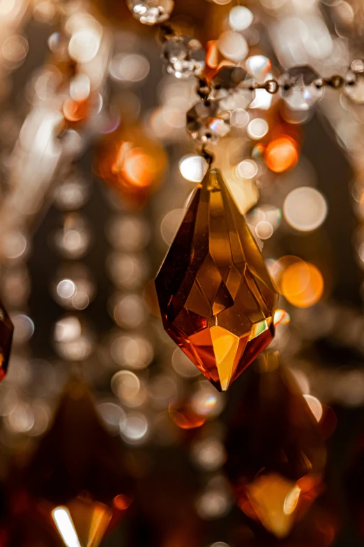 a close up of a hanging crystal item