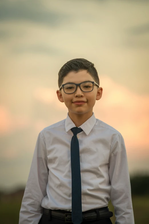 a  with eye glasses on wearing a tie