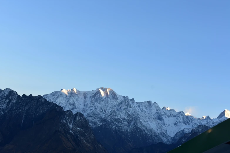 mountains in the distance with a plane out in the foreground