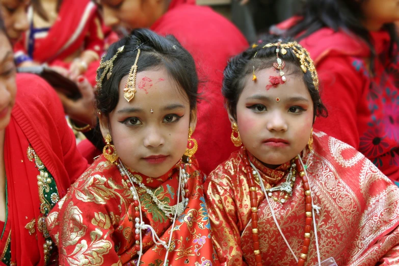 two little girls dressed in oriental garb for their festival