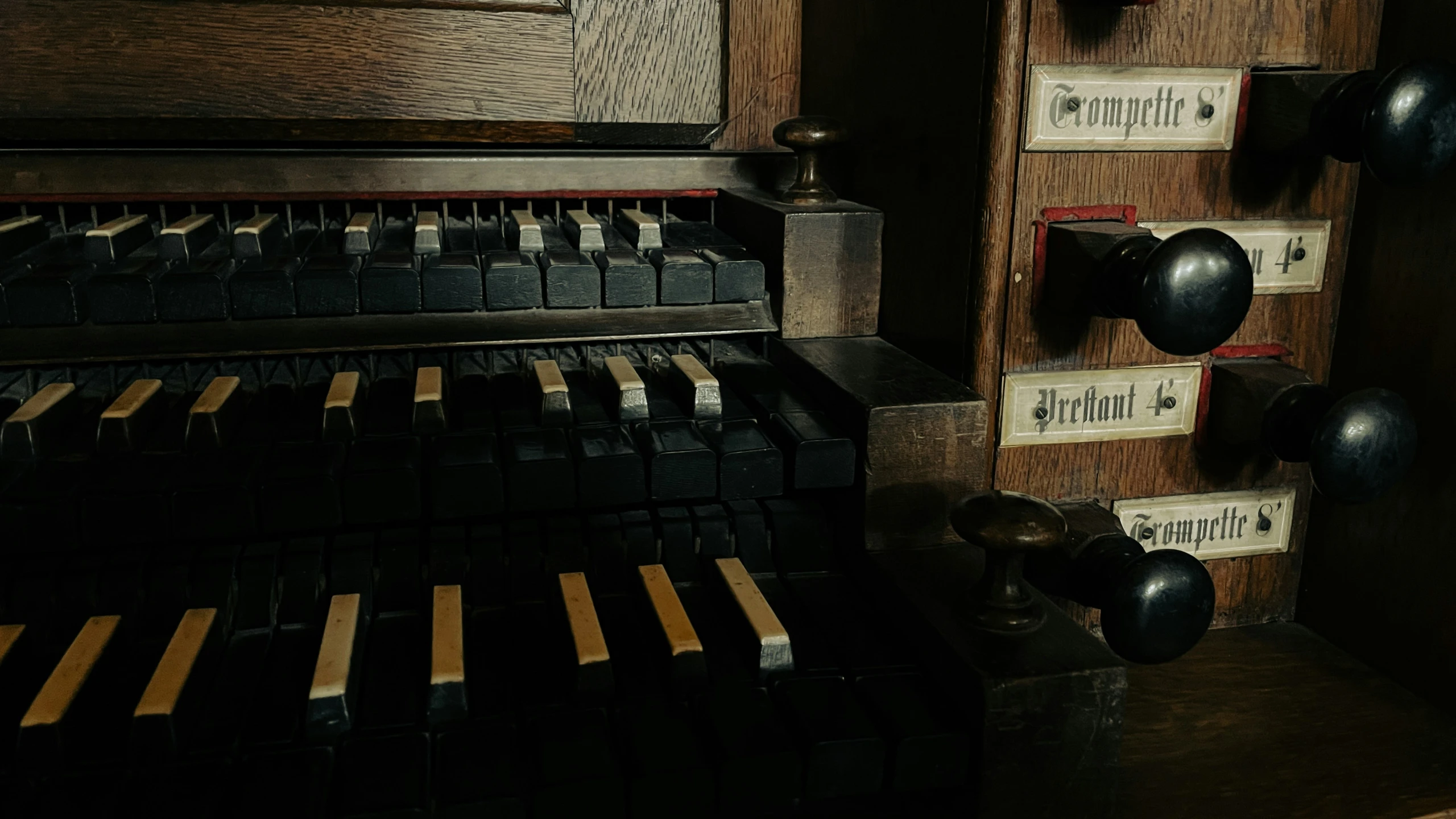 a organ made from wood with labels on them