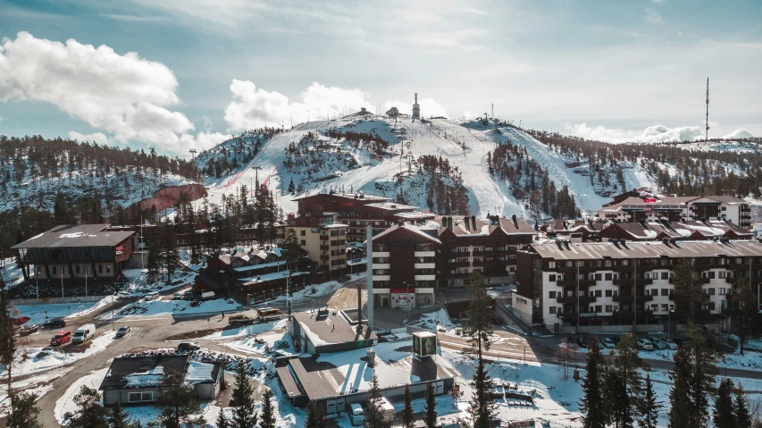 the ski area at the base of the mountains covered with snow