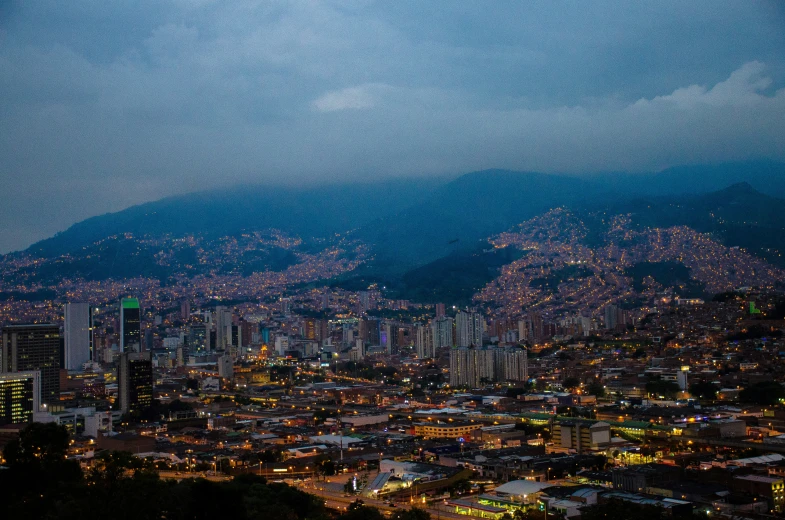 the cityscape is lit up and lit up at night