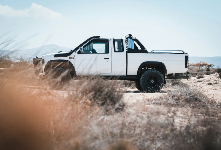 white pick up truck on a desert plain