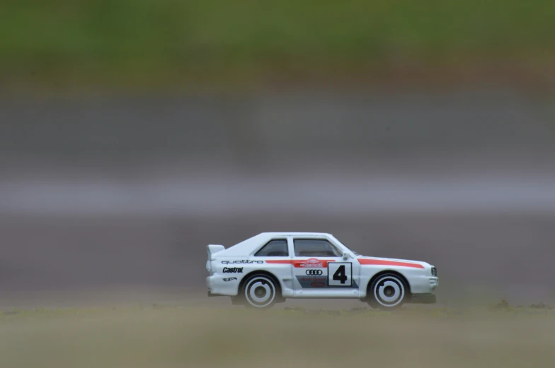 a toy car is shown in the middle of a blurry po