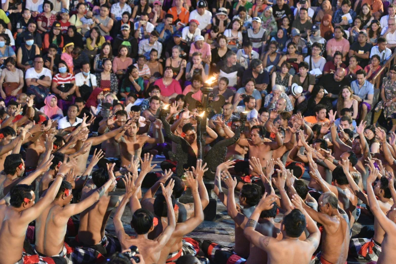 a large group of men and women standing together