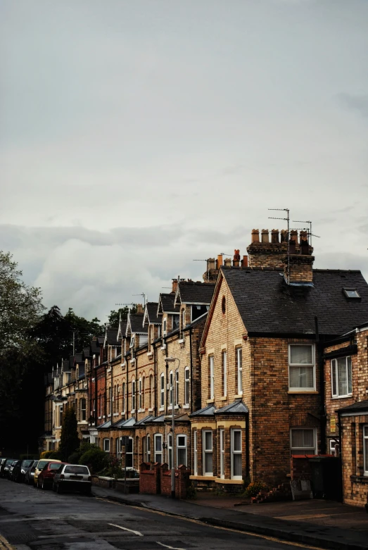 some very pretty old looking houses on the side of a street