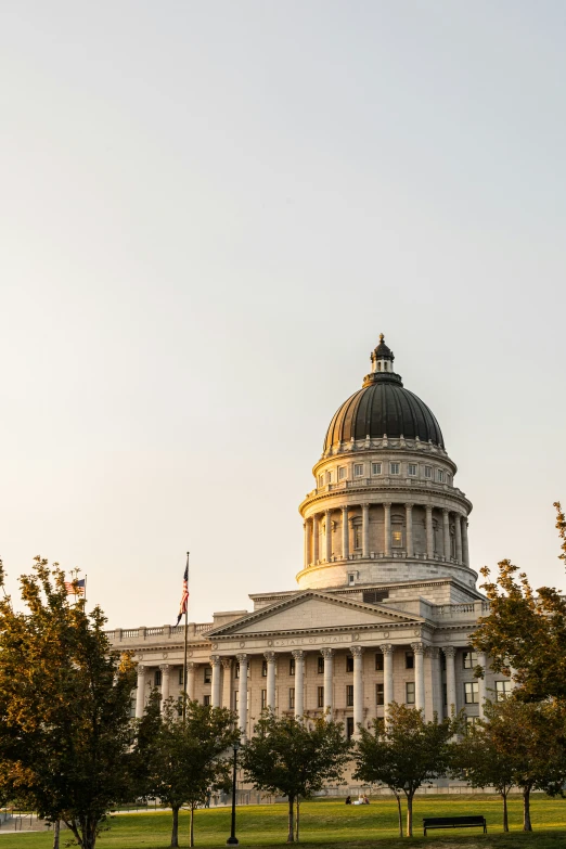 the capitol building is in the midst of a sunny day