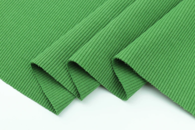 a close up s of a plain color green fabric