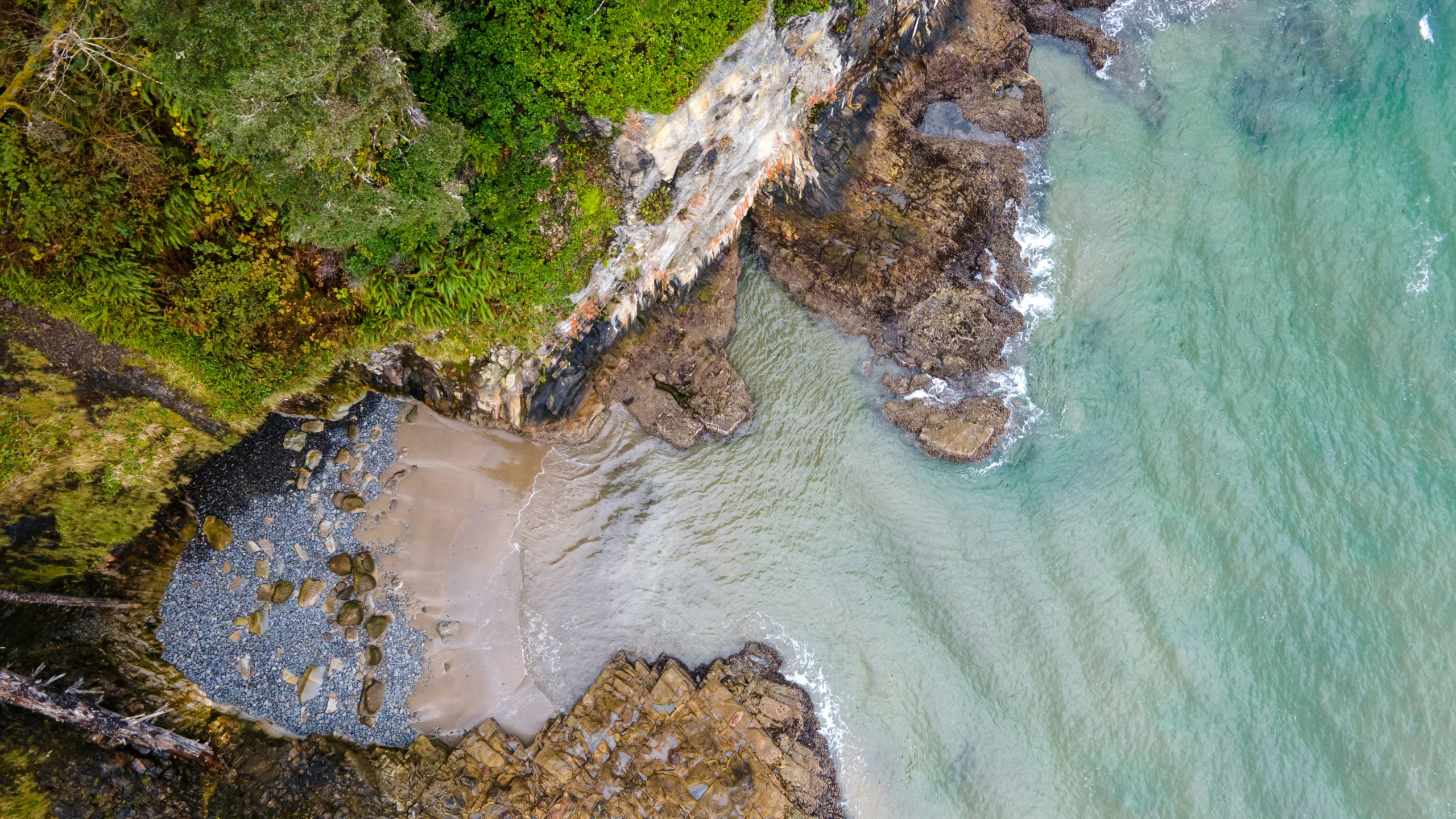 aerial po of rocks and water near shore