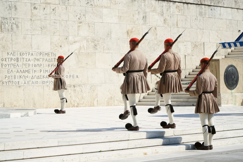 soldiers are on duty in their uniforms walking