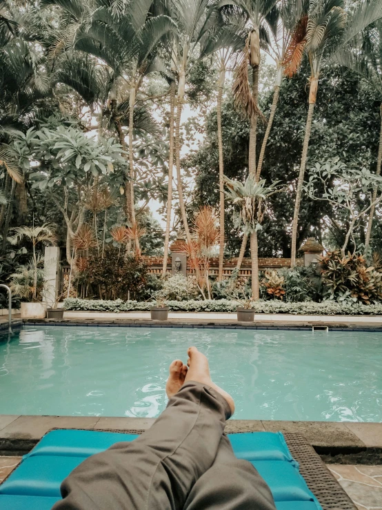 someone in a large pool takes a break