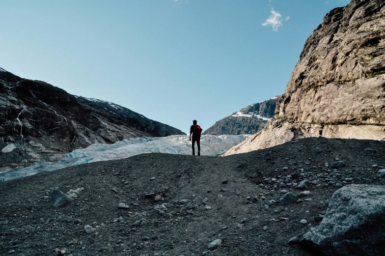 a person standing on top of a dirt hill