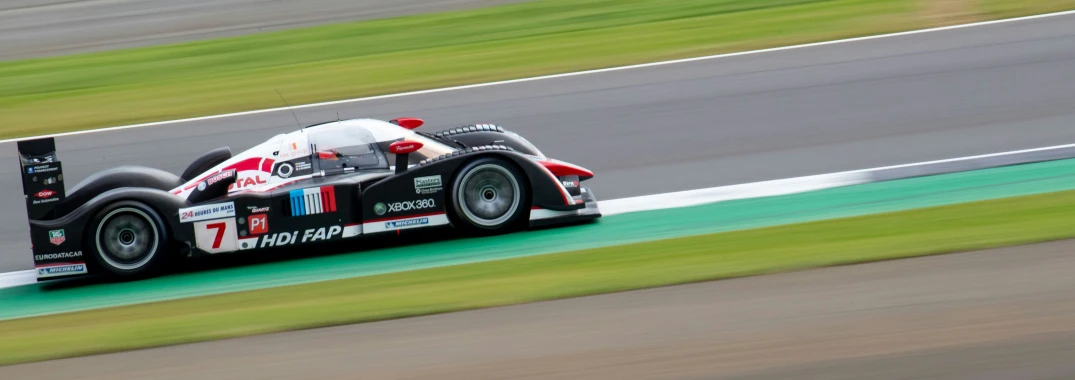 an older model racing car on a track