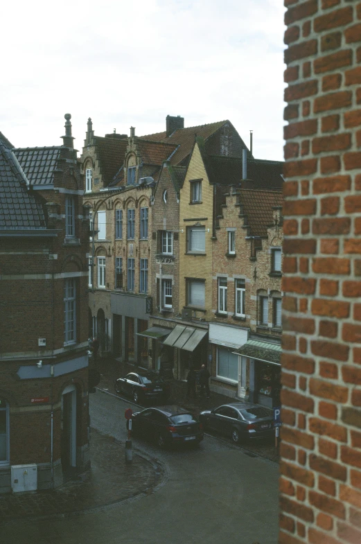 a building on a cloudy day, looking through a window