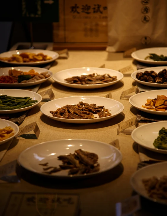 a table filled with bowls and plates of food