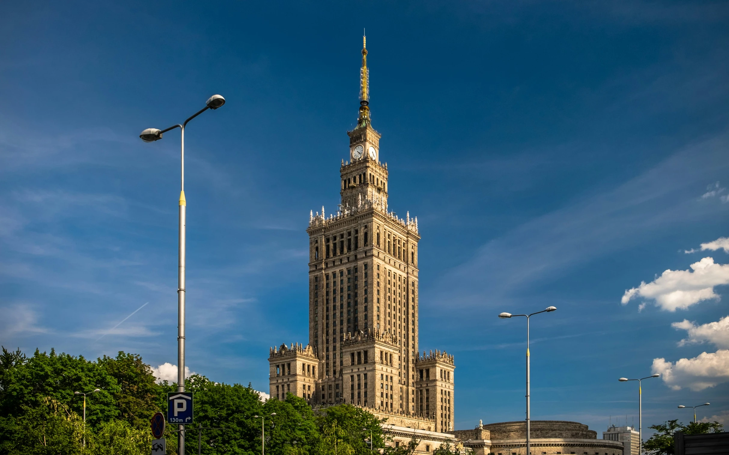 a clock tower near other tall buildings