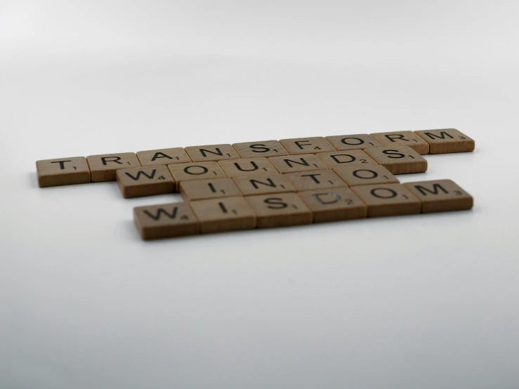 a bunch of word tiles laying on top of a table