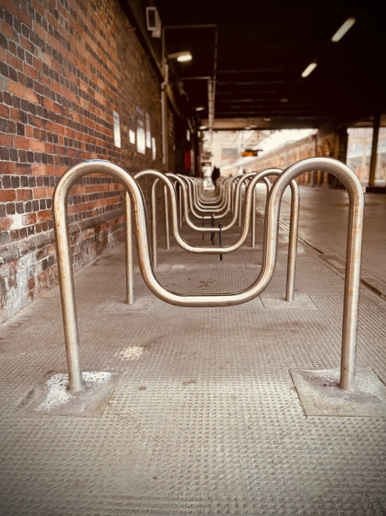 a building filled with metal turns on the sidewalk