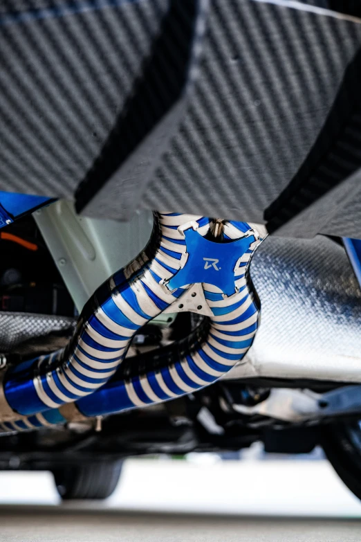 the front end of a bike with blue and white stripes