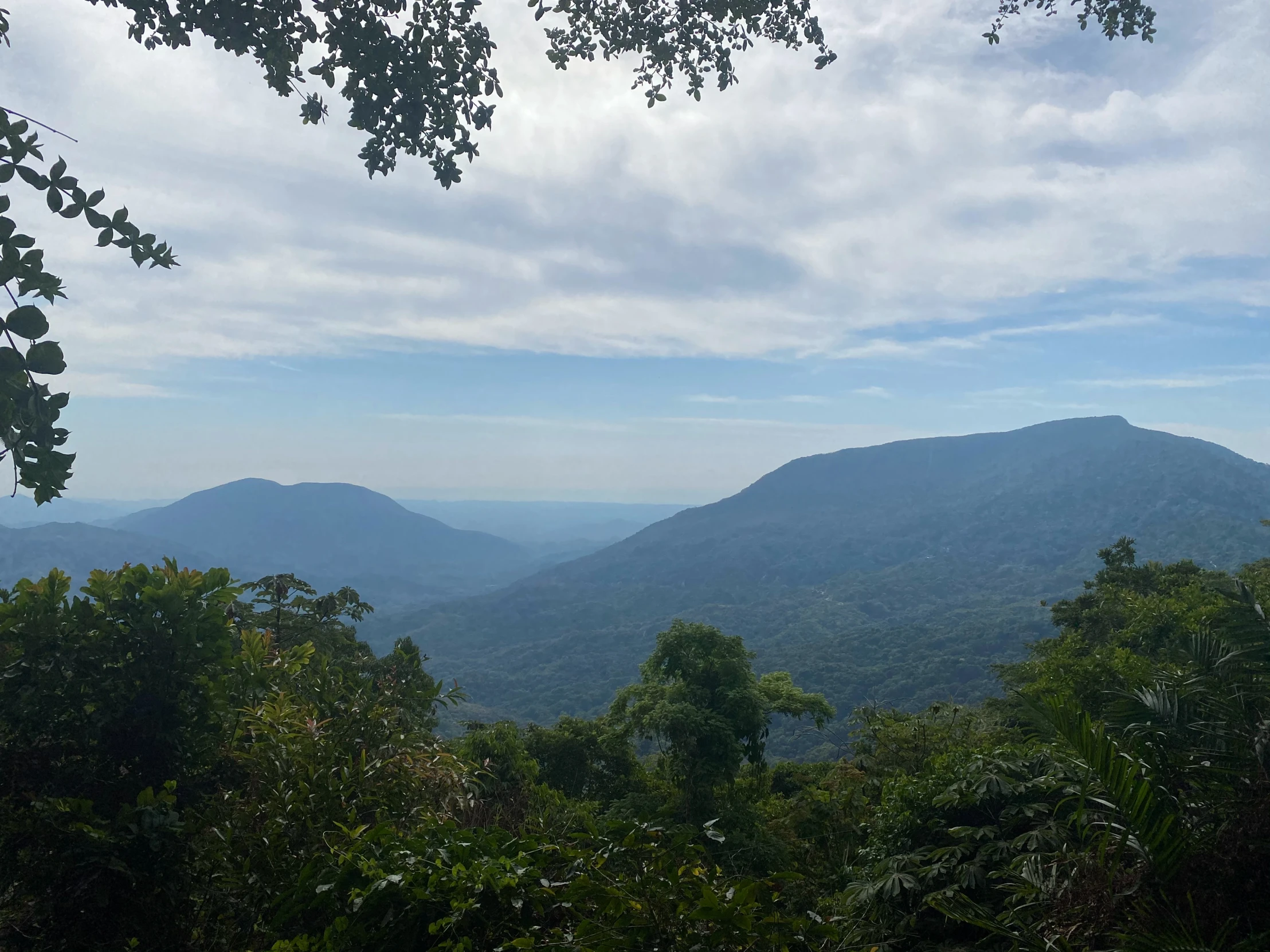 a mountain is shown seen on the top of a hill