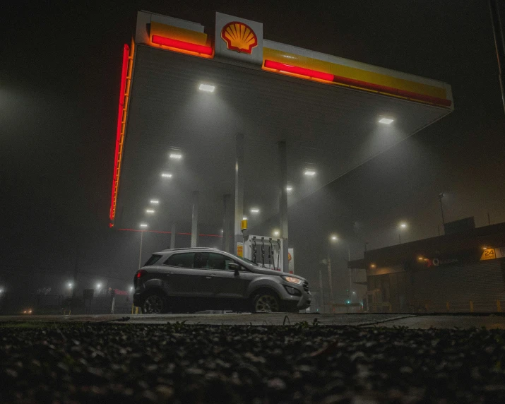 the car is driving through the station entrance