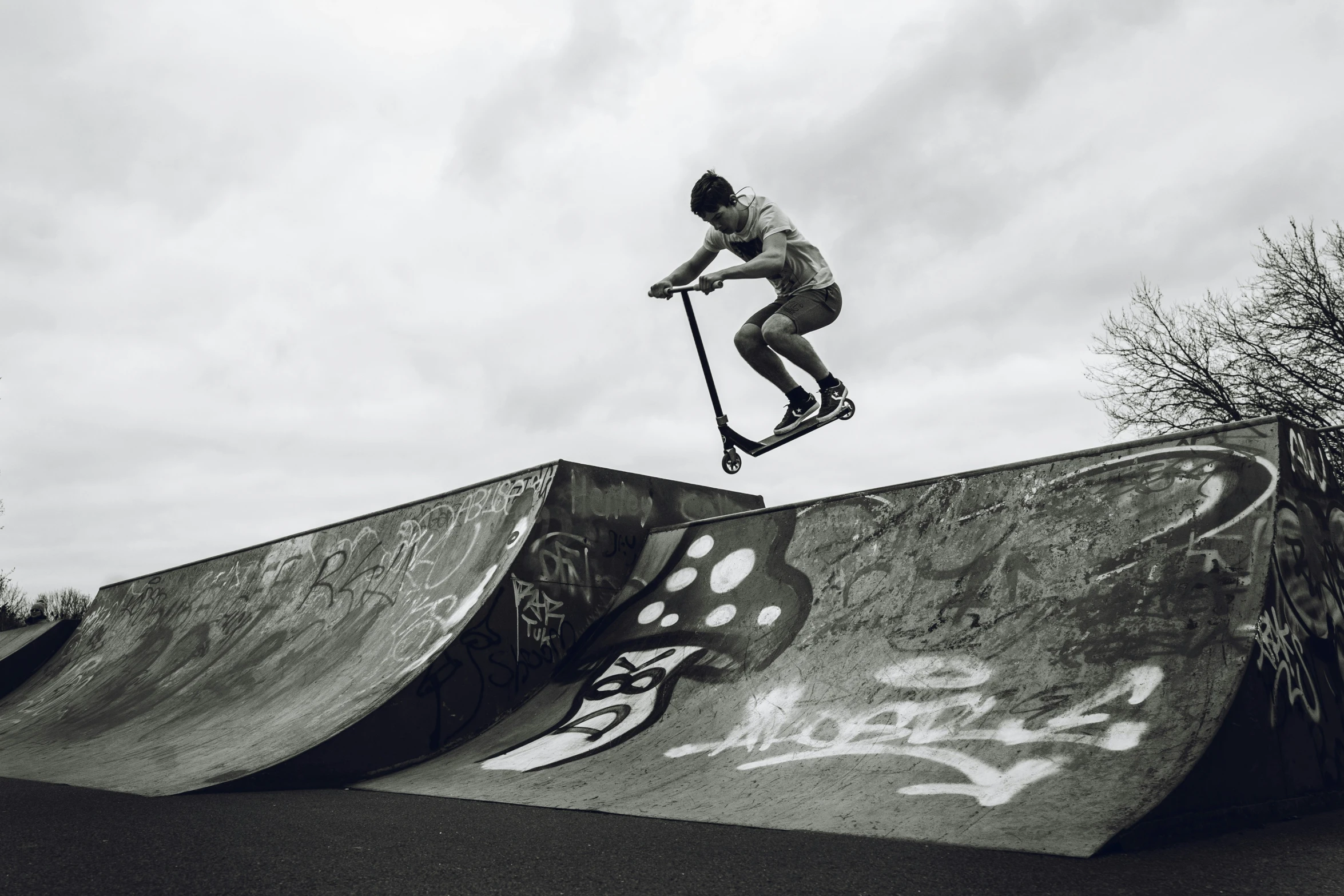 a person jumping up into the air on a skateboard