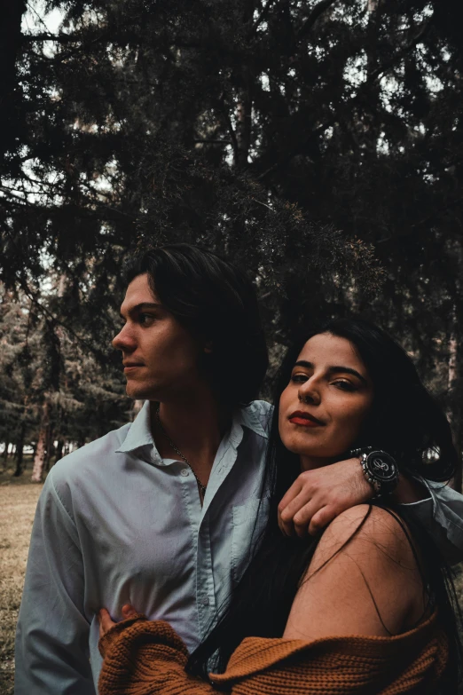 man and woman in park posing for a picture