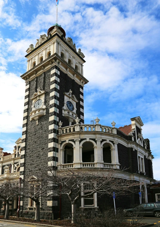 a clock is sitting on the tower of a building