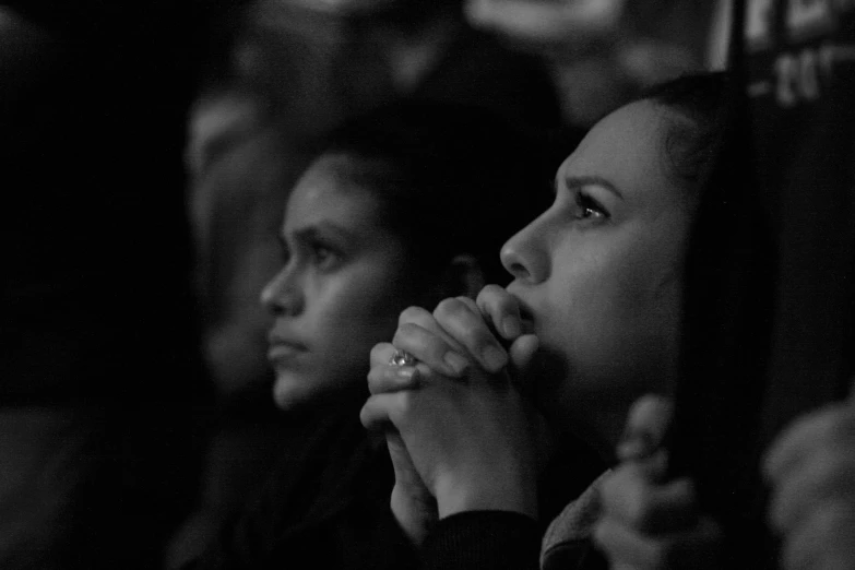 some people standing in a line looking up at soing