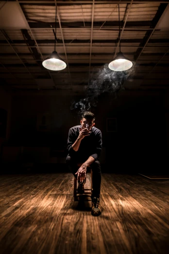 man sitting on a chair with smoke coming out