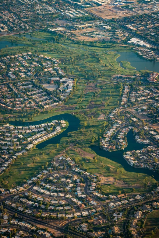 aerial pograph of a river winding through a city