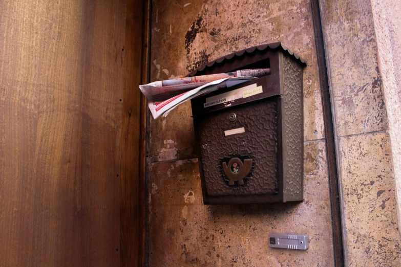 an old fashioned mailbox on a wall