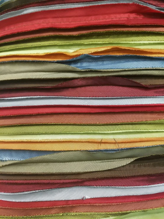 stacks of fabric on a bed sheet for the comforter