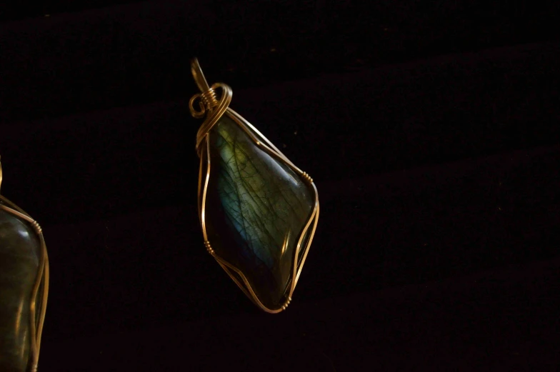a beautiful pendant hangs from a piece of ss wire